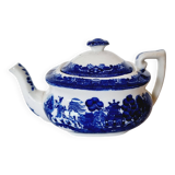 Small porcelain teapot or milk jug with the famous blue willow or weeping pattern