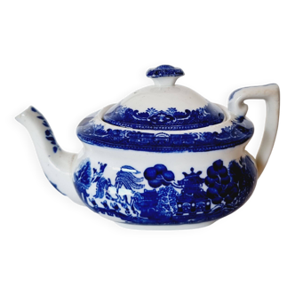 Small porcelain teapot or milk jug with the famous blue willow or weeping pattern