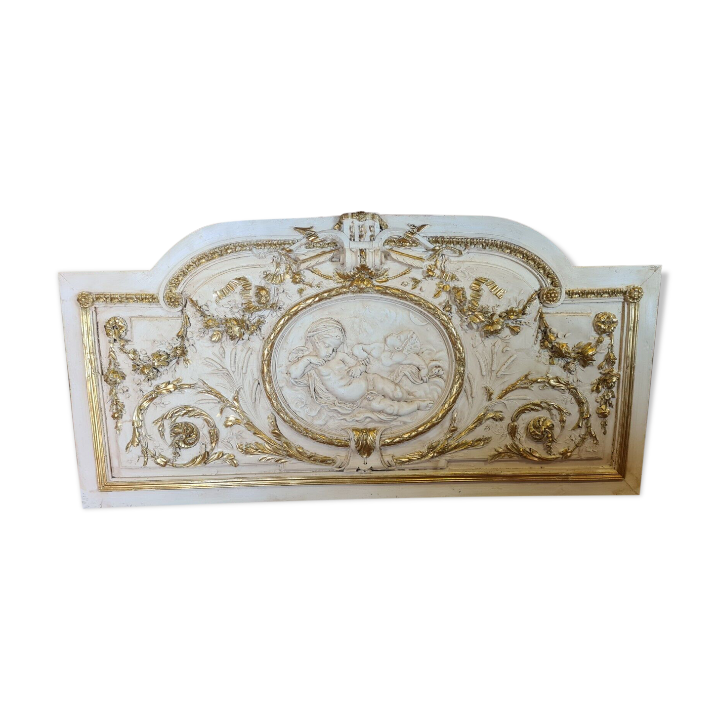 Pediment panel with stucco and wood angels
