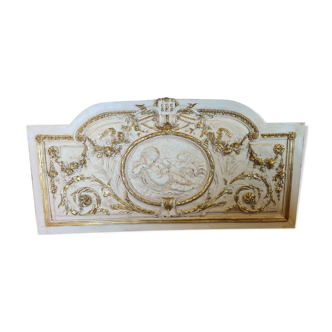 Pediment panel with stucco and wood angels