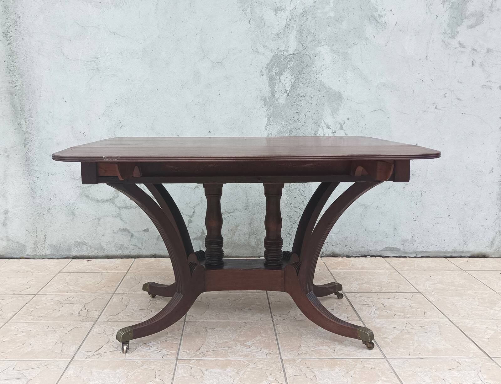 19th-century English style mahogany drop-leaf table.