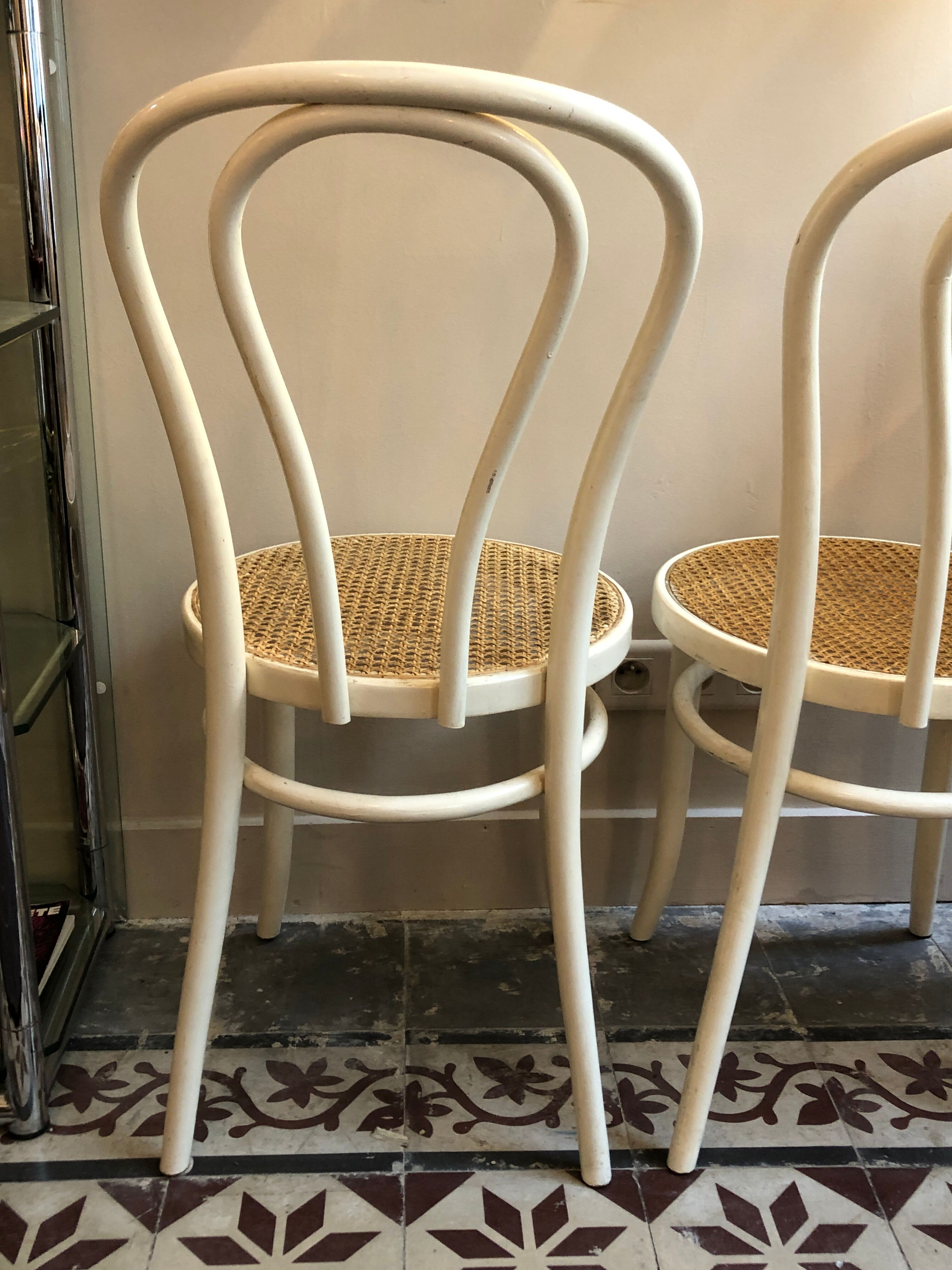 Couple of white bistro chairs