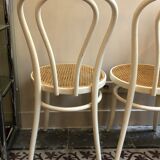 Couple of white bistro chairs