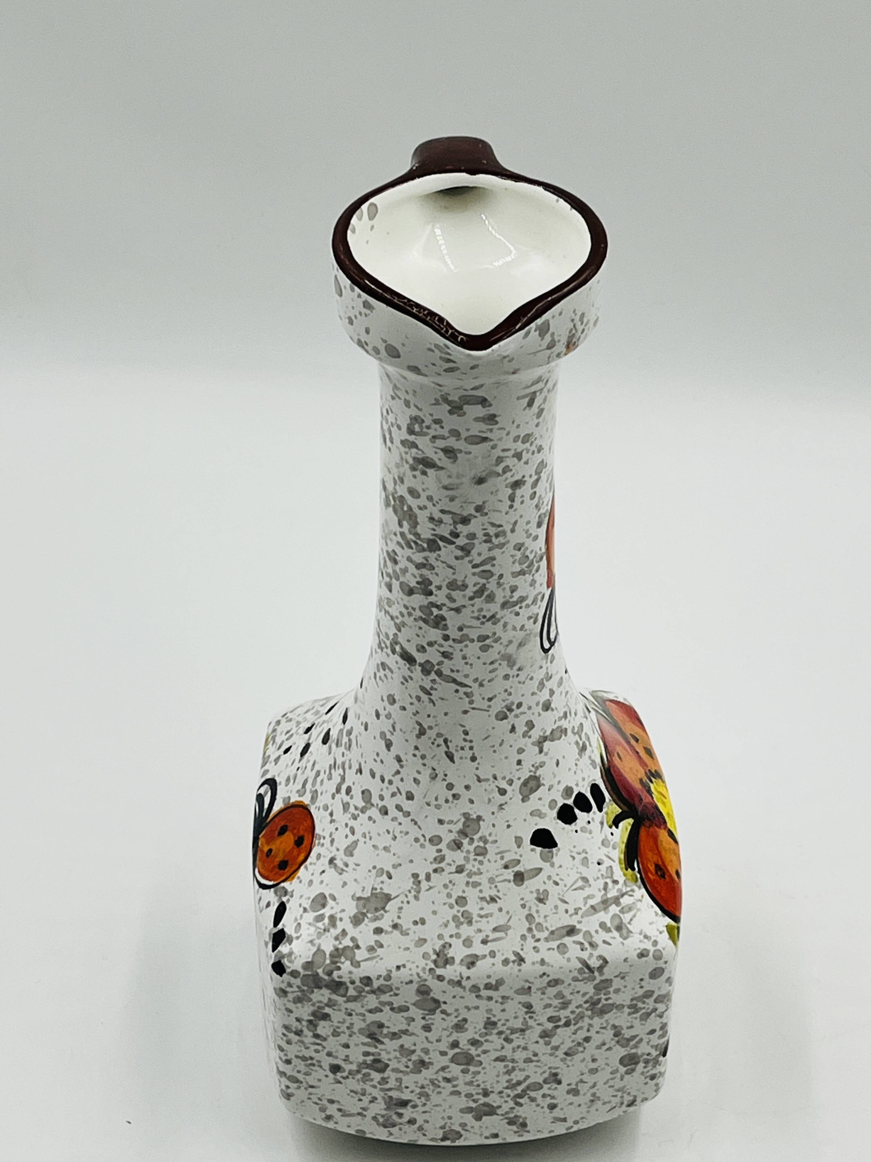 Vintage Italian vase in the shape of a carafe with floral decoration from the 1970s.