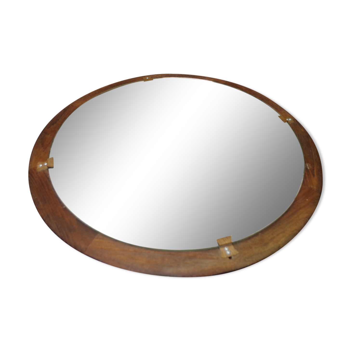 Round mirror in a vintage teak wood frame