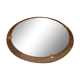 Round mirror in a vintage teak wood frame