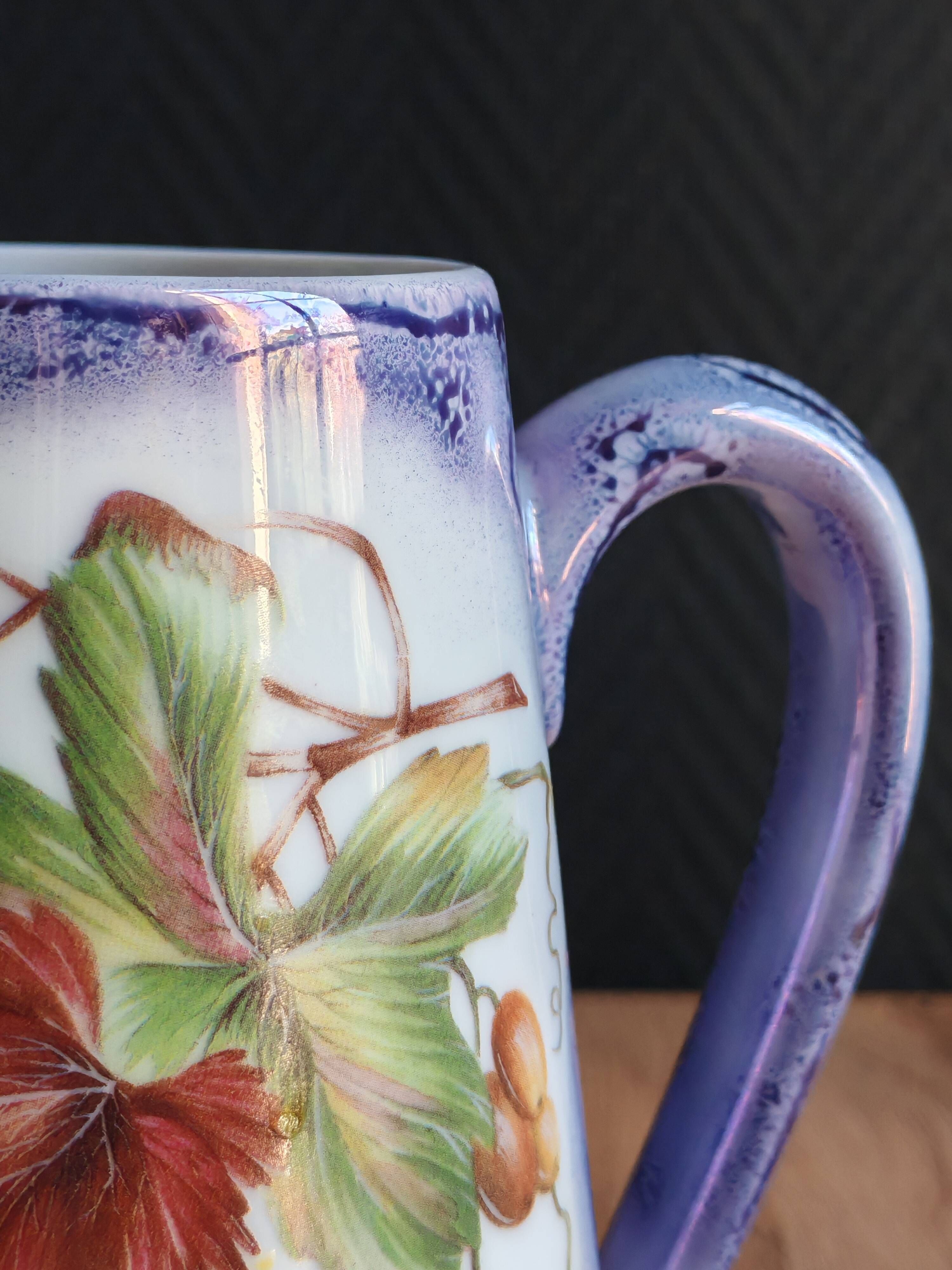 Vintage porcelain pitcher Lusseray France, decorated with grape clusters.