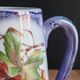 Vintage porcelain pitcher Lusseray France, decorated with grape clusters.
