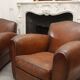 Lot de 2 fauteuils club en cuir années 50