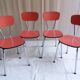 Suite de 4 chaises en formica rouge