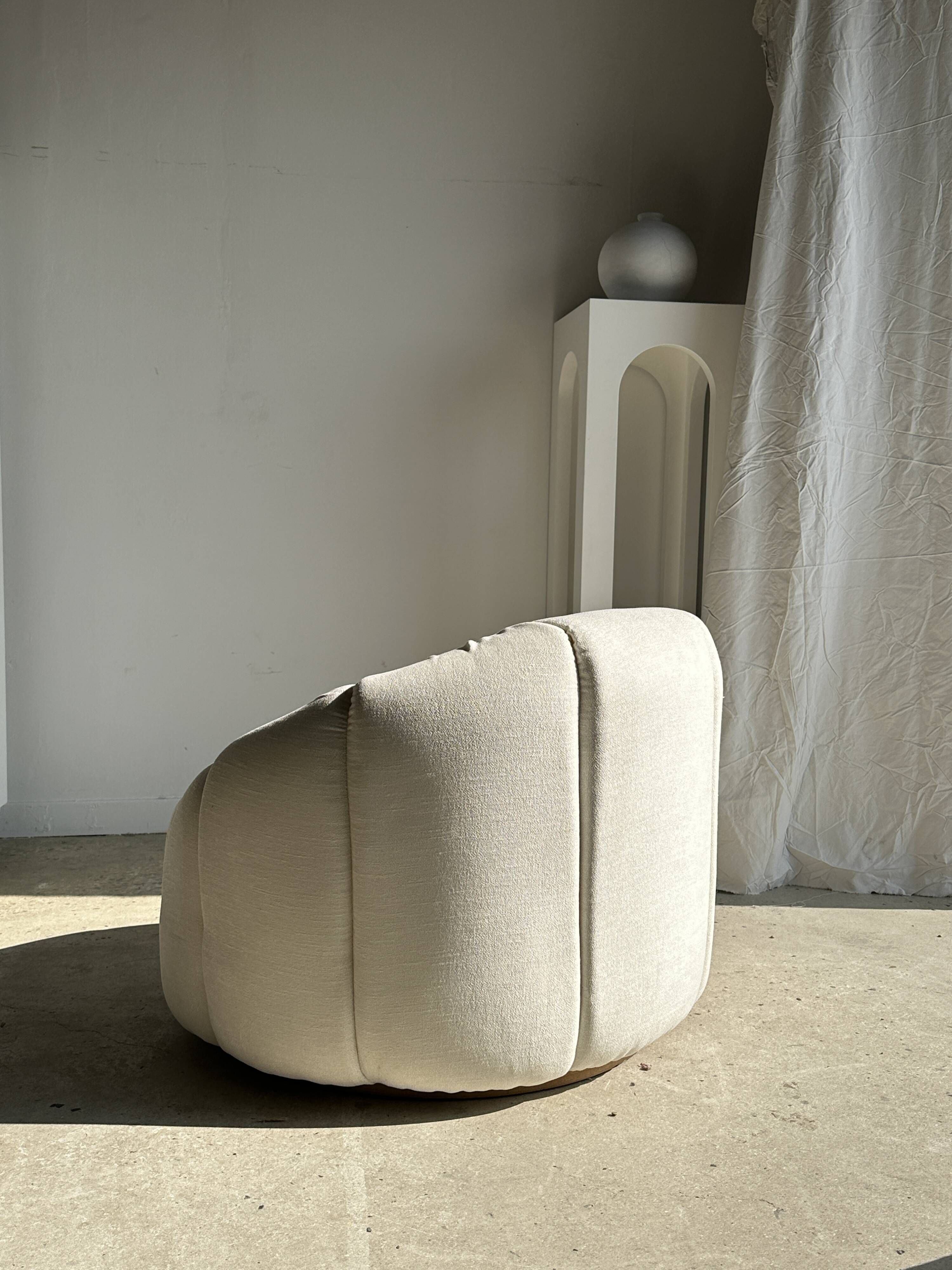 Large white circular armchair, white fabric upholstery