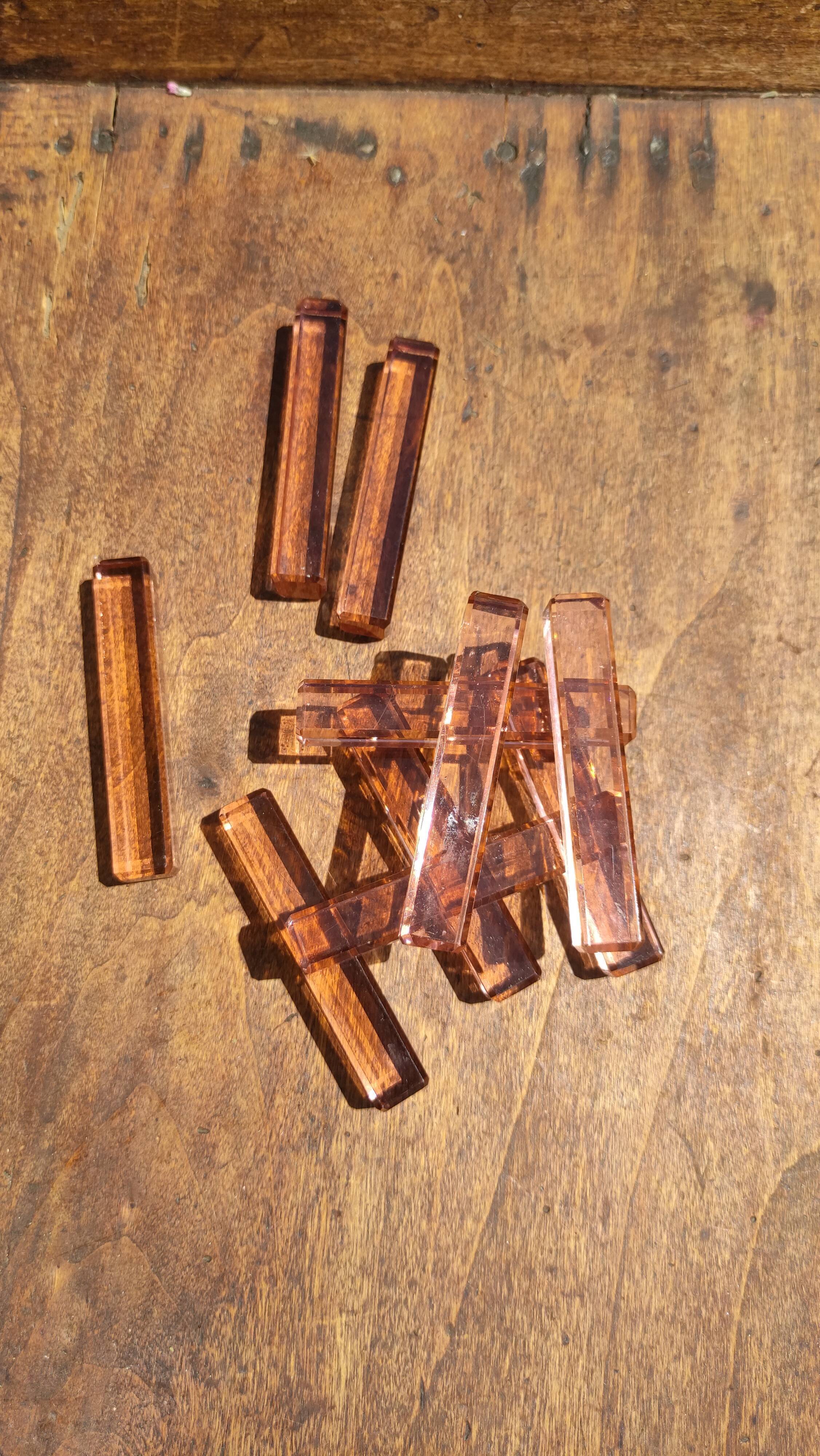 Ten pink glass knife holders