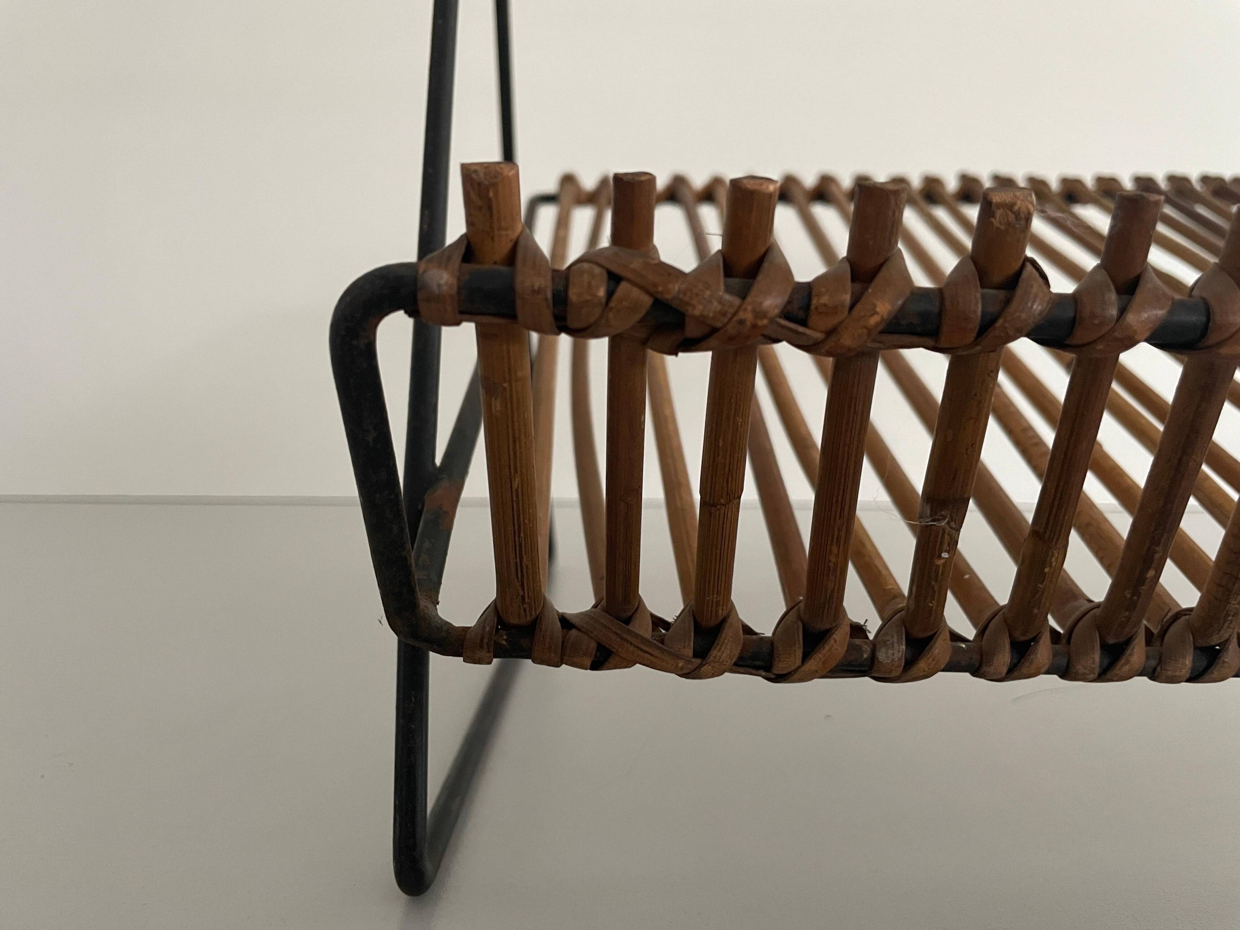 Mid-century black metal and rattan magazine rack, 1960, Italy