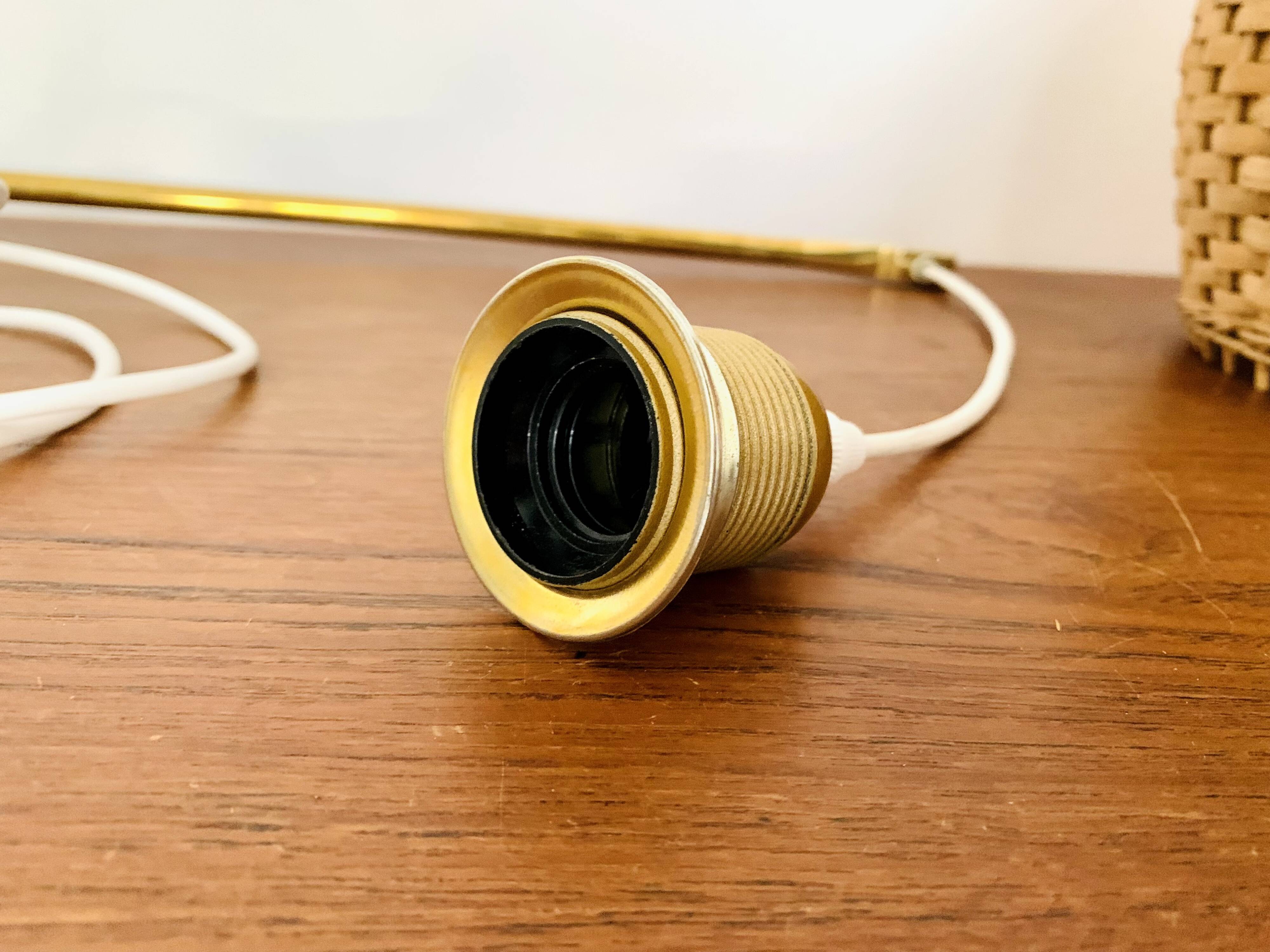 Adjustable Brass and Wicker Arc Sconce