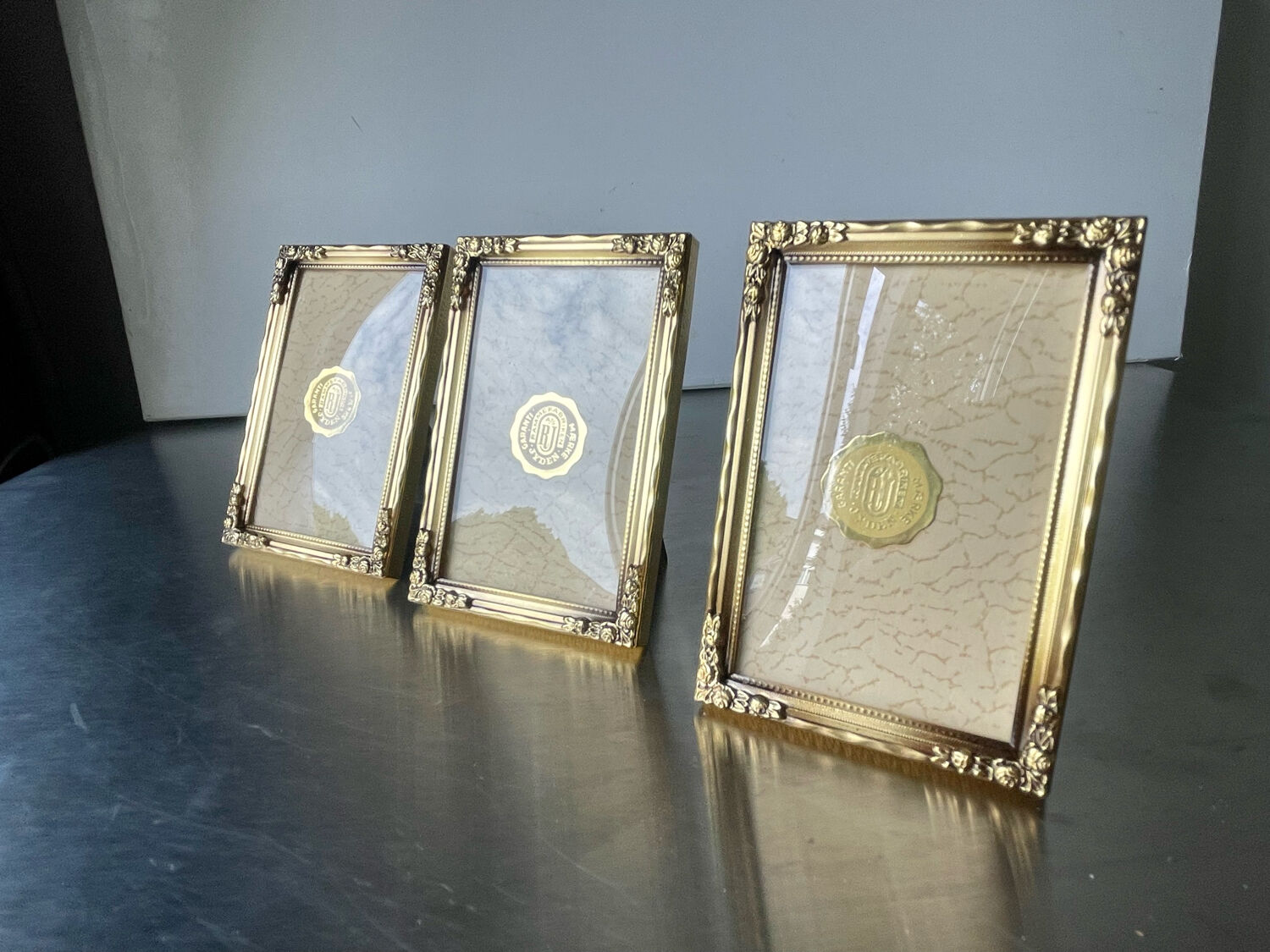 Set of 3 vintage identical gold colored metal picture frames convex glass
