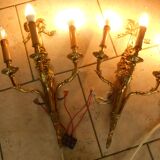 Pair of gilded bronze wall sconces with three lights