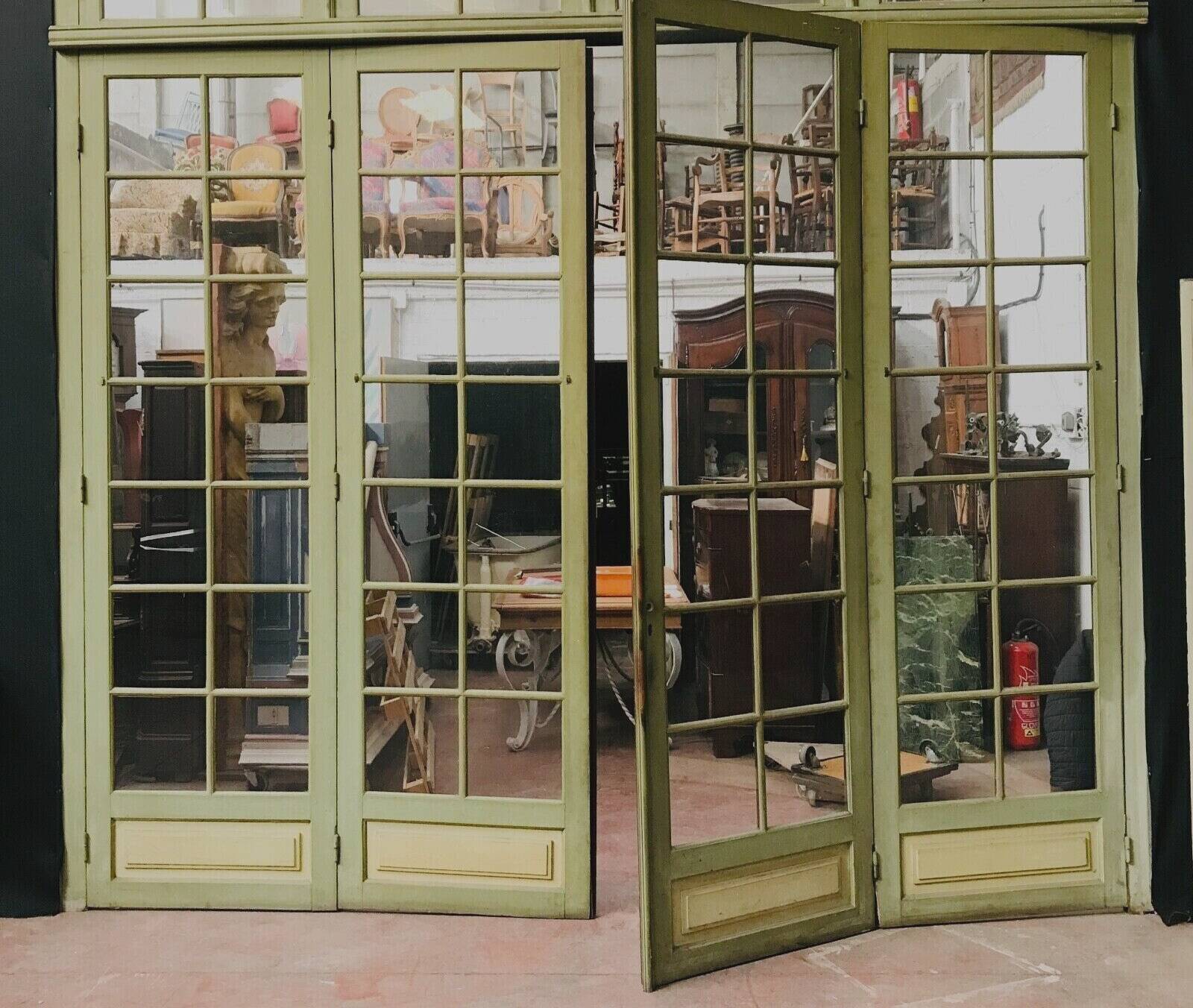 Four partition doors with small panes in 19th century patinated wood