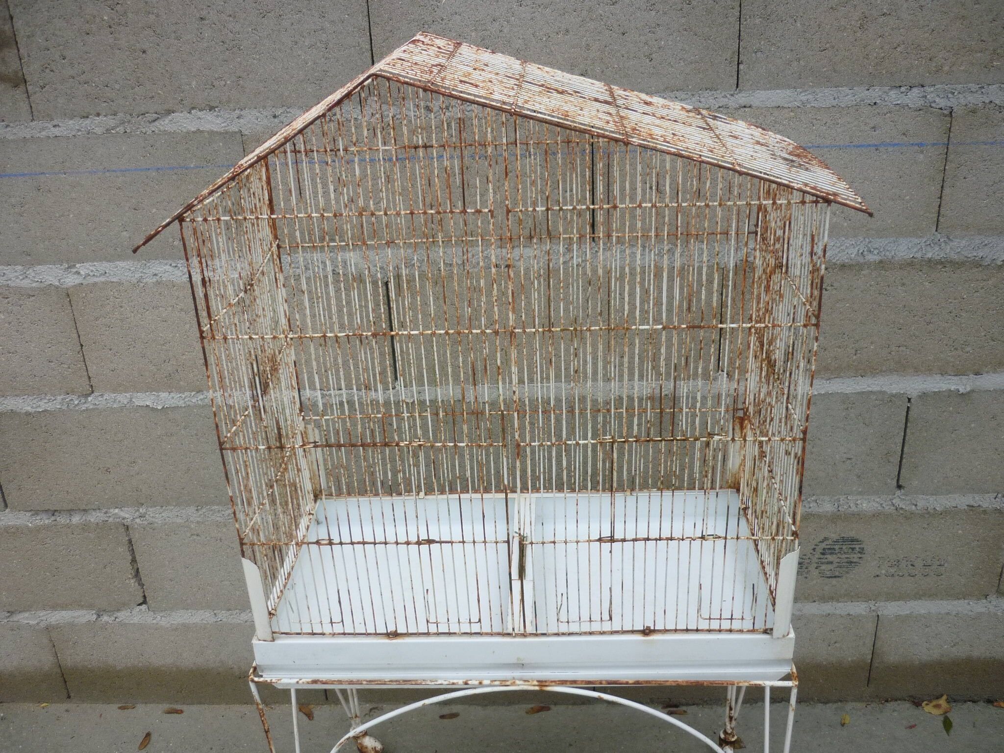 Bird cage with its wheeled holder
