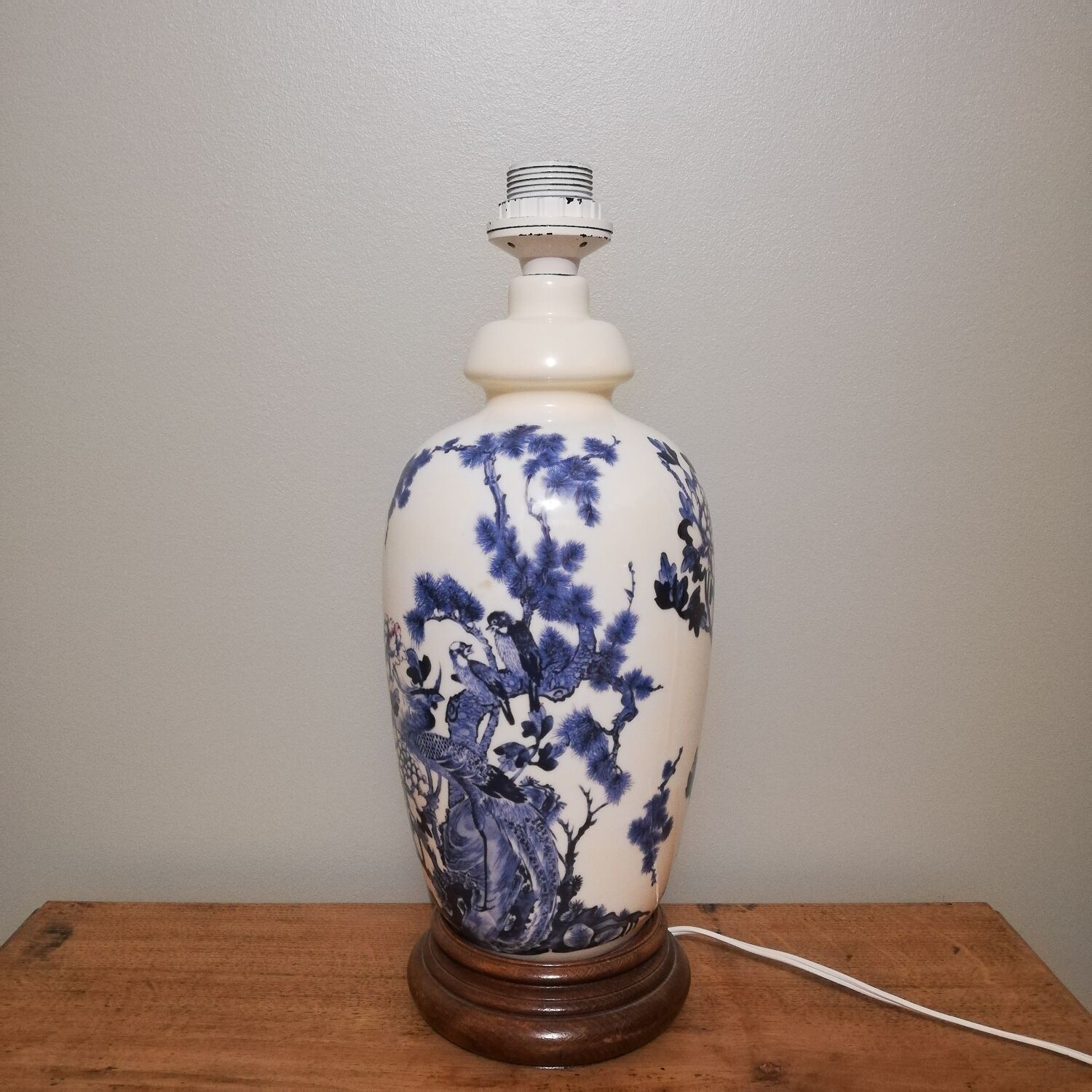 Ceramic lamp with Asian decoration with matching lampshade.