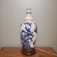 Ceramic lamp with Asian decoration with matching lampshade.