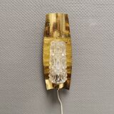Older wall lamp in brass with hard pressed glass shade.