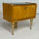 Pair of bedside tables in wood, brass and black glass top