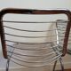 2 chrome wired chairs