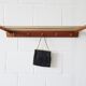 Wall coat rack with hat rack made of teak and gold metal,