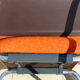 The 1970s orange armchair fabric and chrome metal