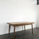 Modernist teak table with 2 extensions.