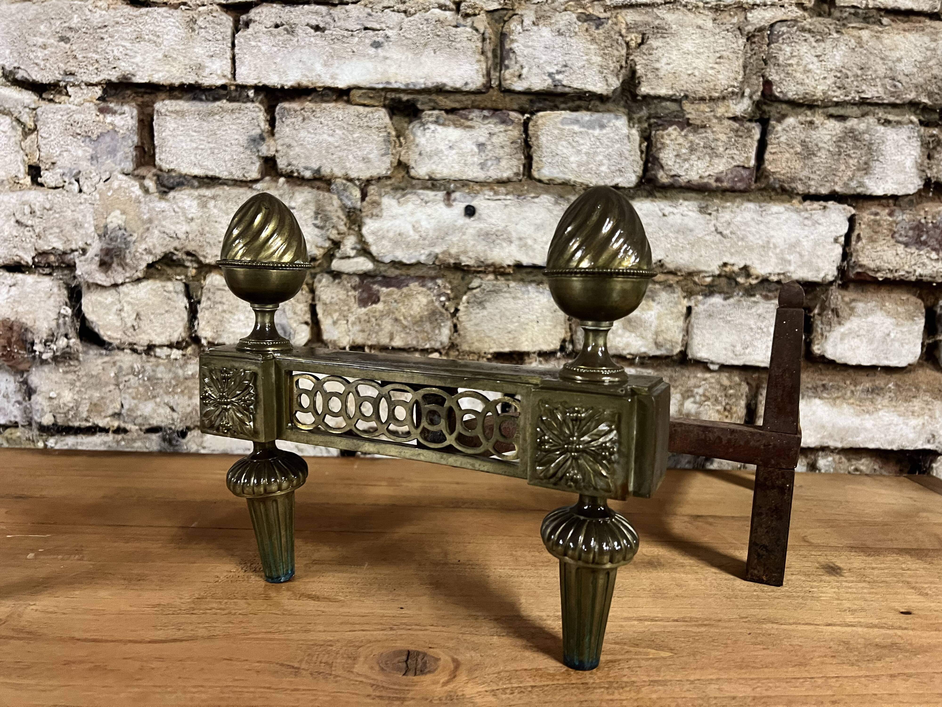 Pair of bronze andirons stamped bouhon frères in louis xvi style