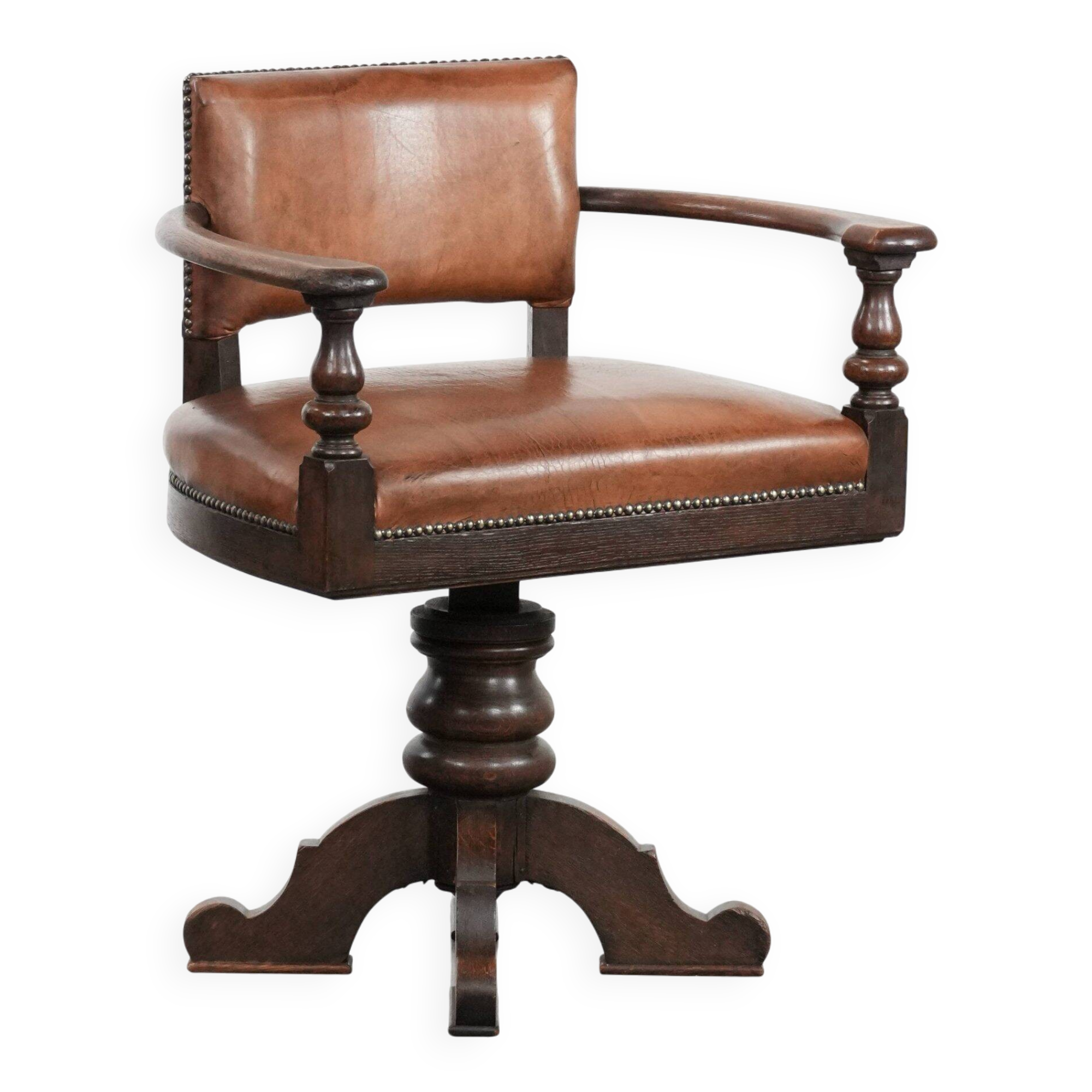 Elegant antique sheepskin leather desk chair with a heavy wooden frame