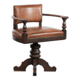 Elegant antique sheepskin leather desk chair with a heavy wooden frame
