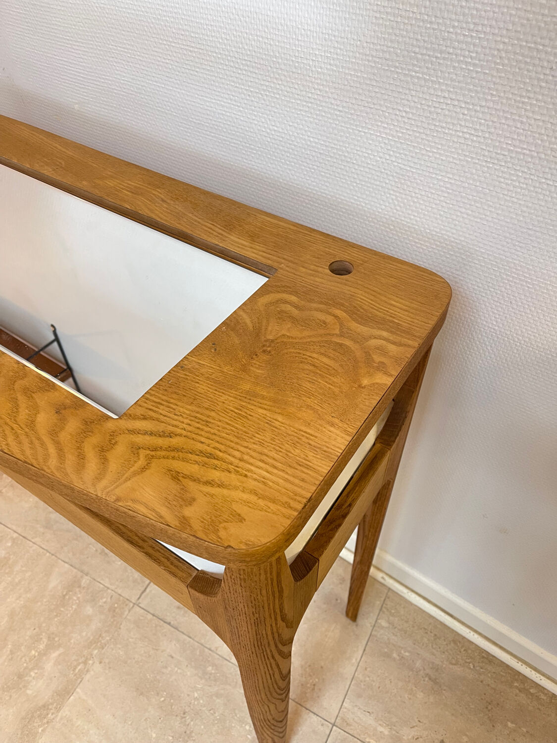 Small contemporary console in stained walnut wood.