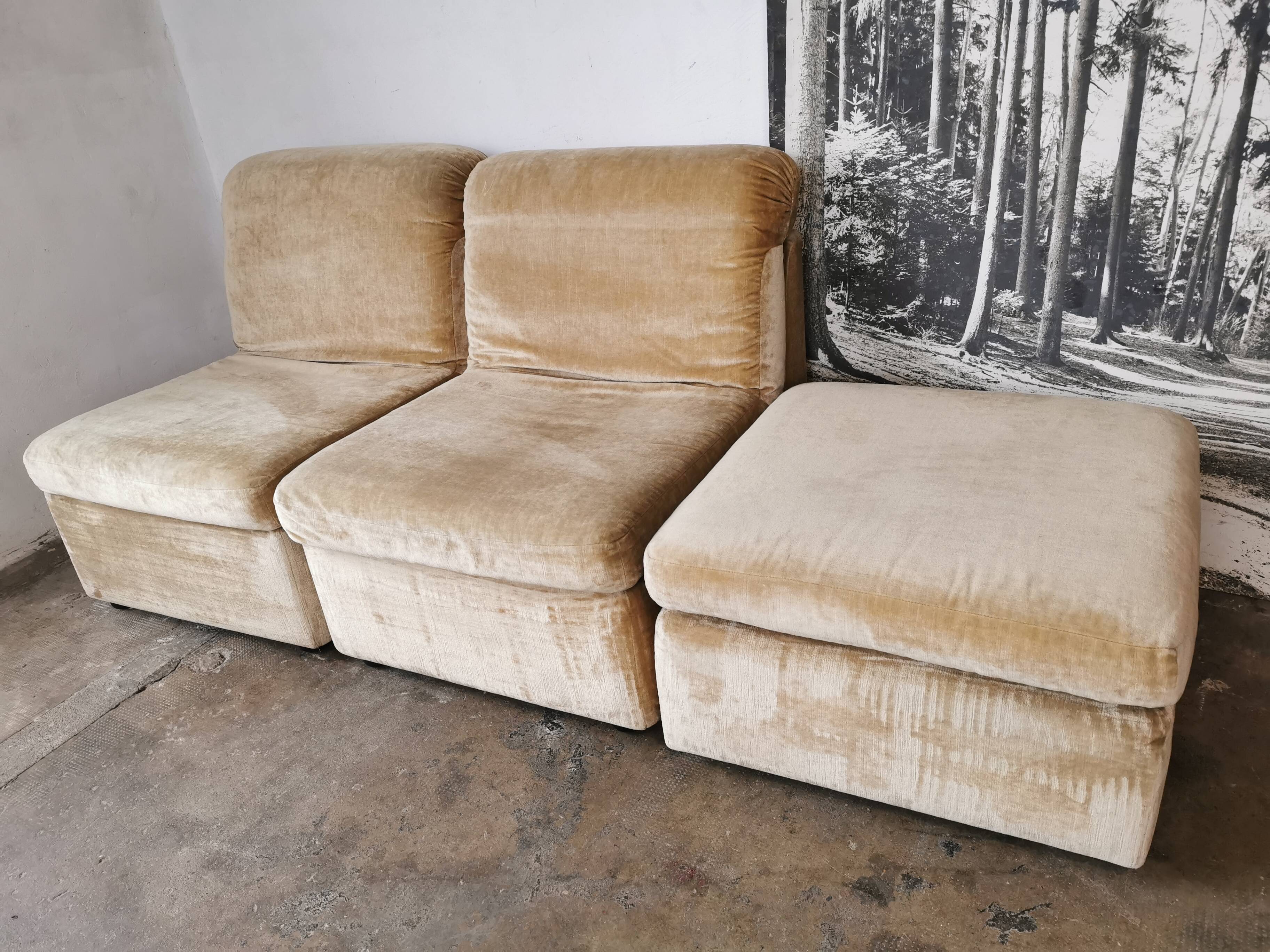 Pair of modular velvet armchairs and ottoman