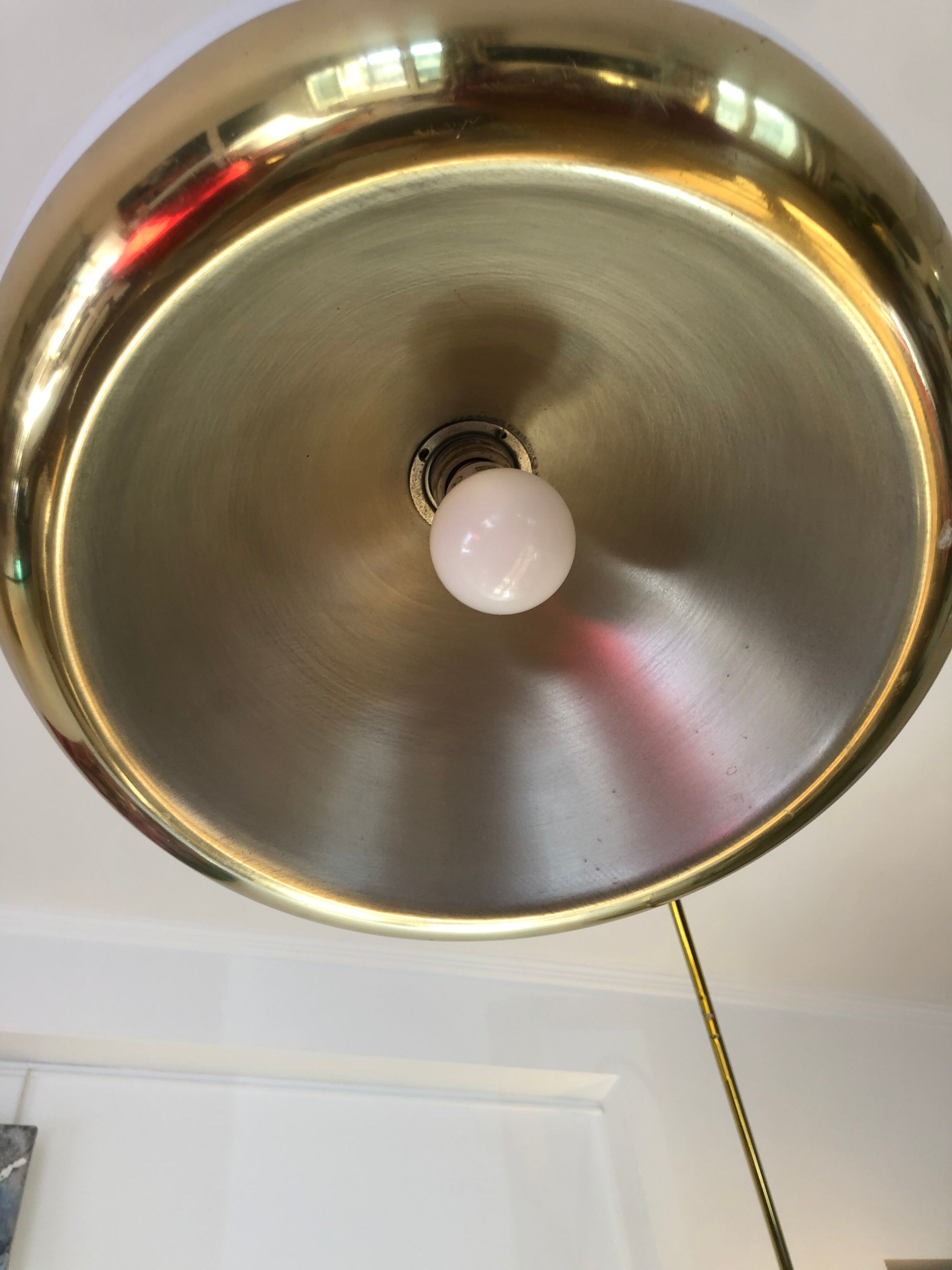 Arc floor lamp by Harvey Guzzini brass model