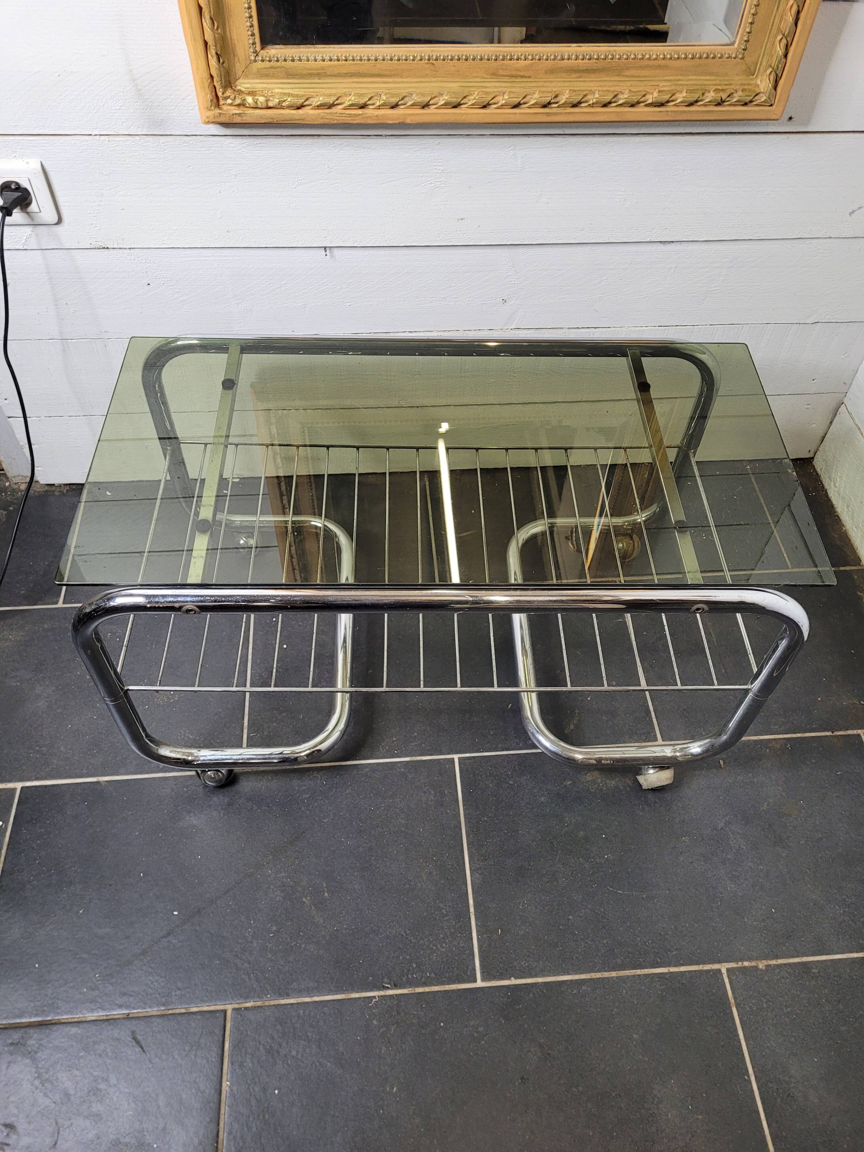 Coffee table with chrome base and smoked glass from the 70s