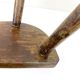 Ancient tripod milking stool - field theme, nature