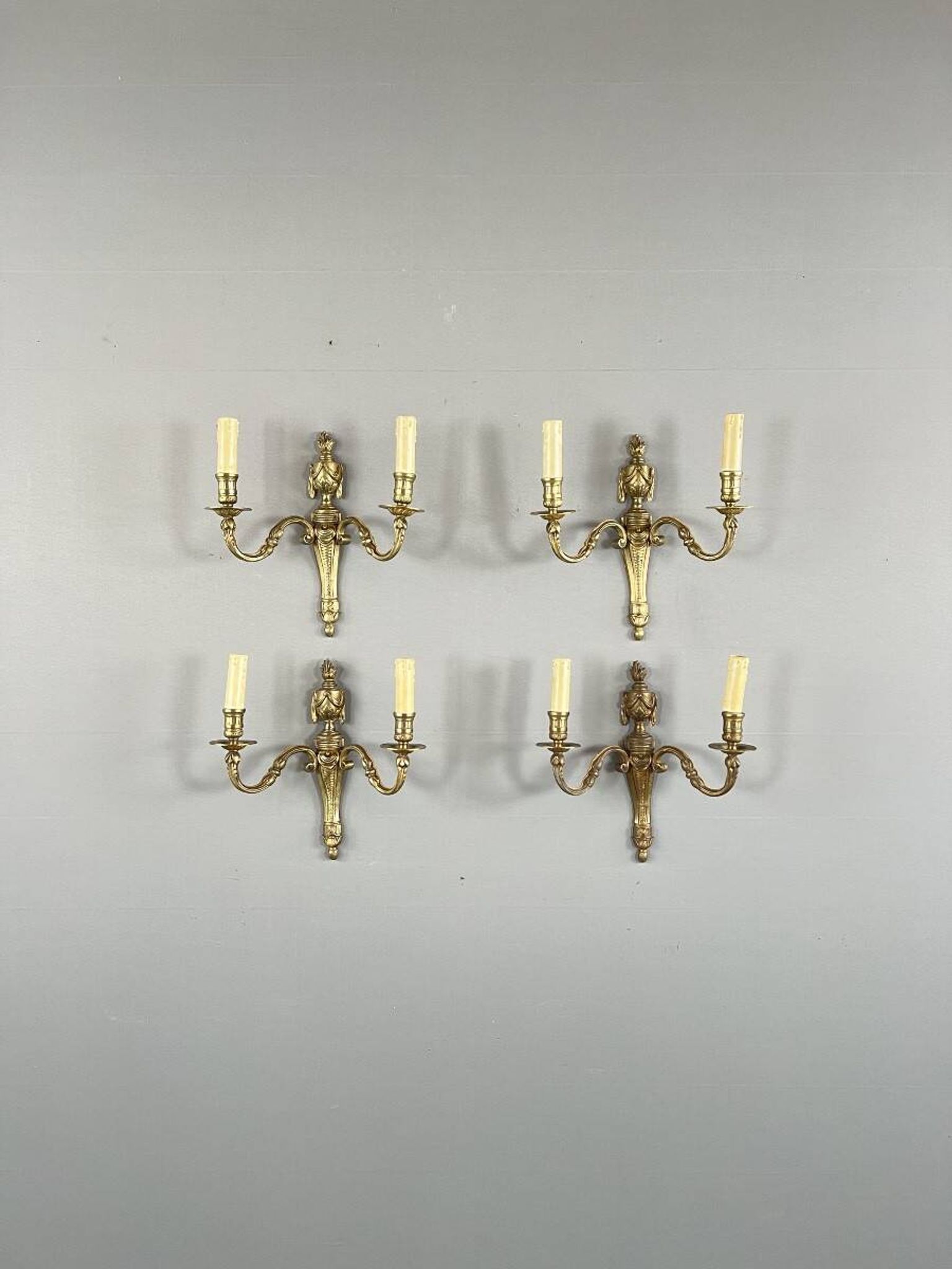 Set of four bronze wall sconces, Louis XVI style, 20th century.