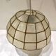 Mother-of-pearl and brass suspension