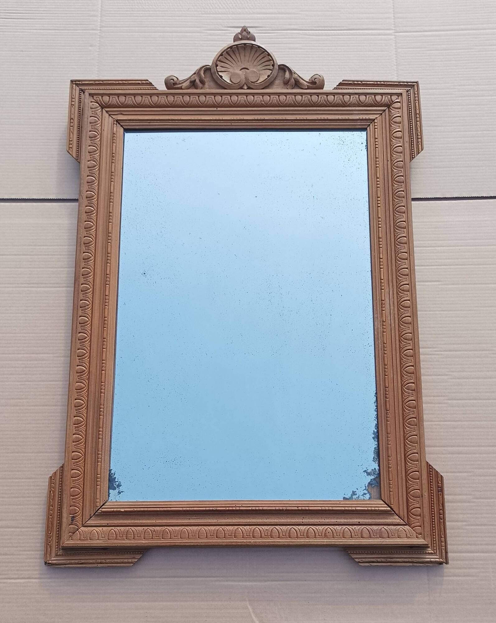 Louis XVI mirror in carved wood, 19th century.