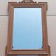 Louis XVI mirror in carved wood, 19th century.