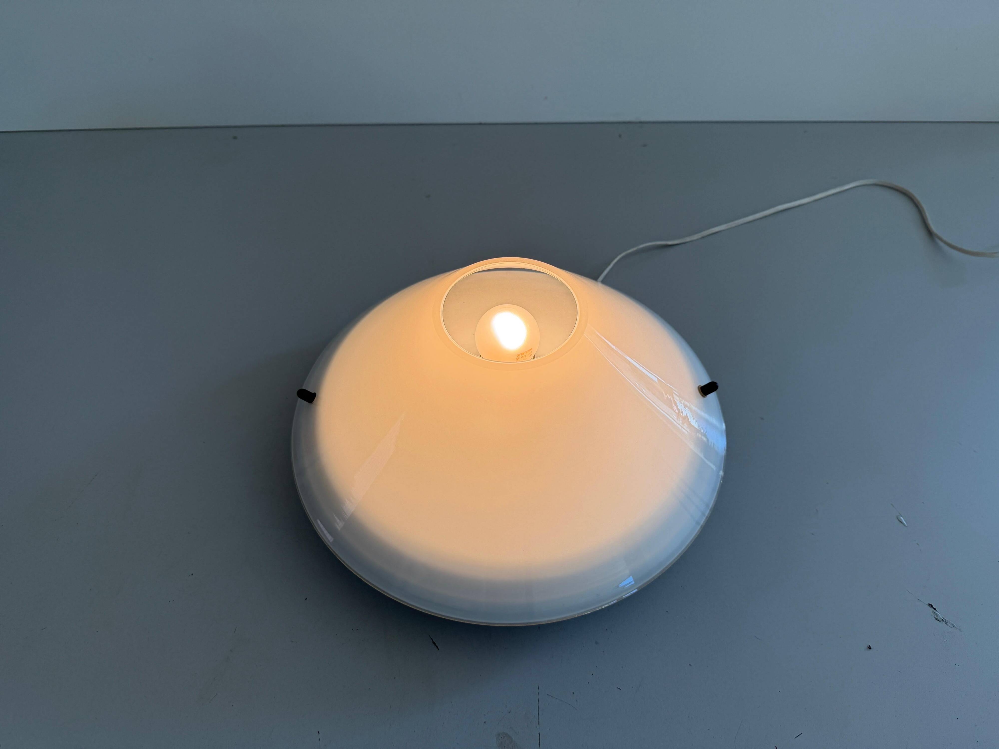 Simple opal glass wall light from the mid-century by Lamperti, 1960s, Italy.