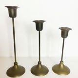 Trio of brass candlesticks
