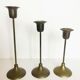 Trio of brass candlesticks