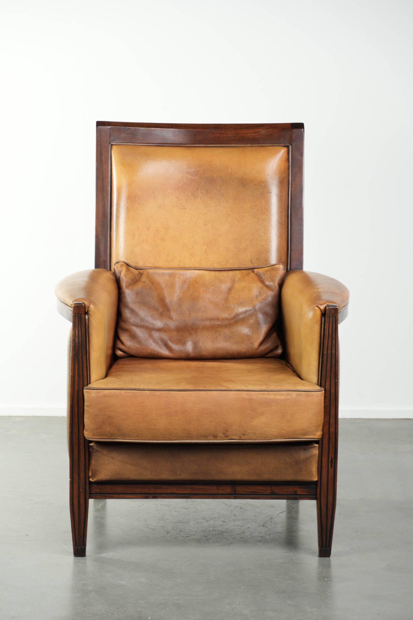 Cognac-coloured Art Deco design armchair made of sheepskin with a high back