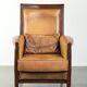 Cognac-coloured Art Deco design armchair made of sheepskin with a high back