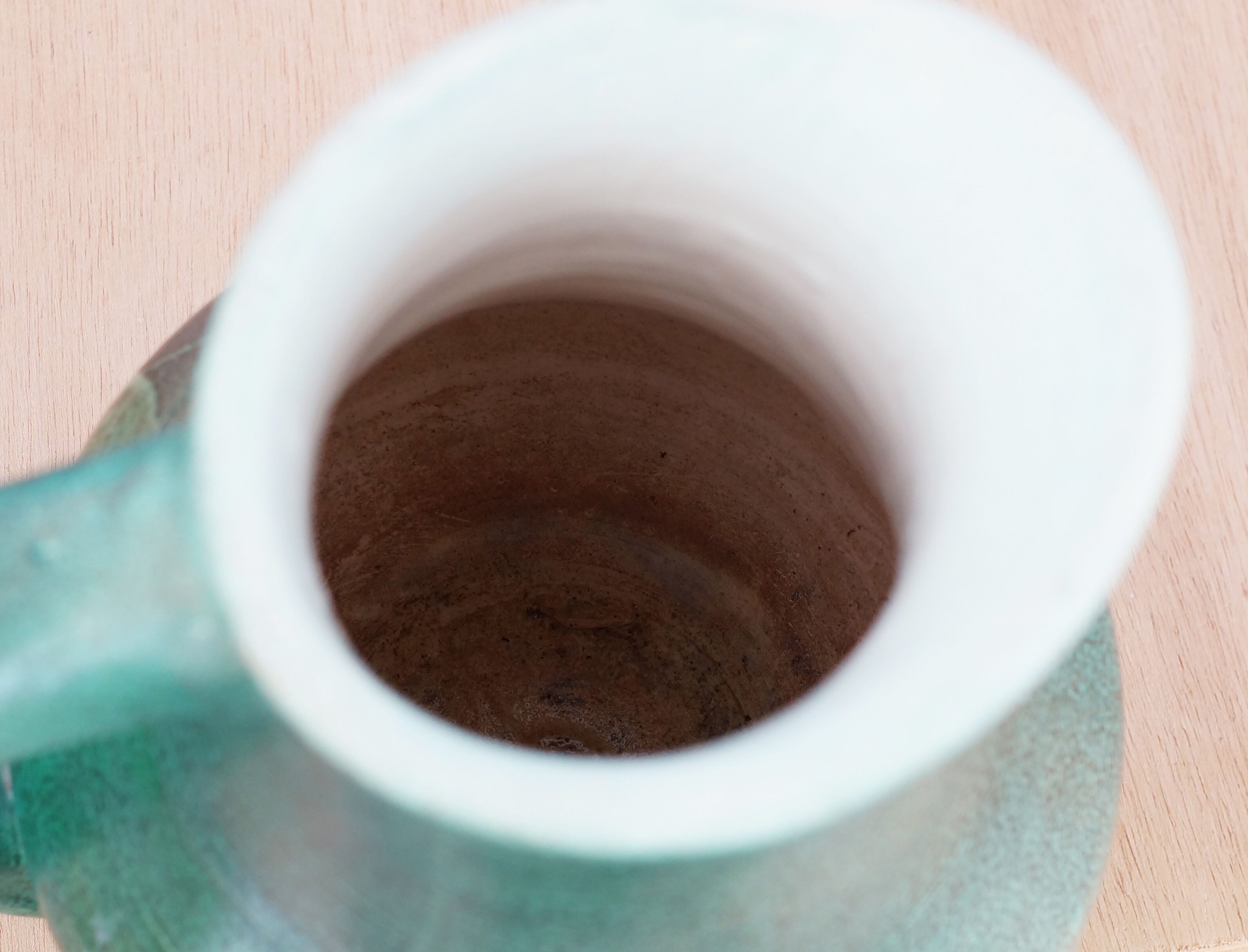 Ceramic jug enamelled in shades of green, signed, vintage