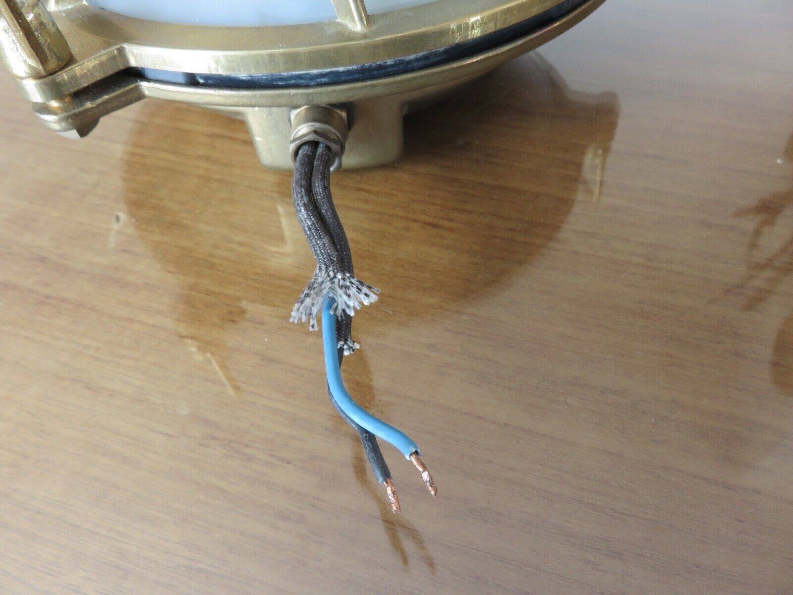 Brass porthole wall lamp