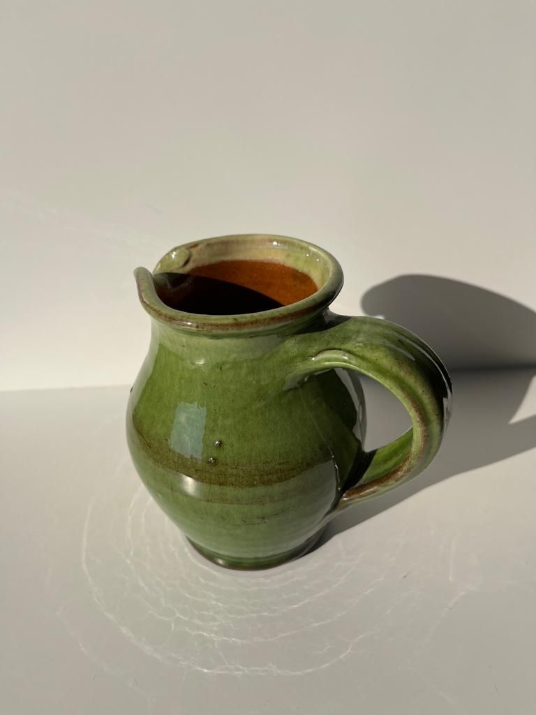 Green glazed ceramic pitcher